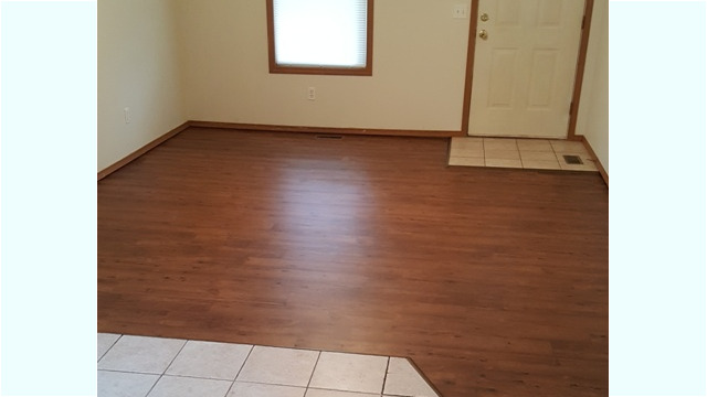 Enter into the hardwood-floored living room