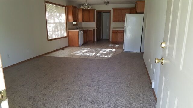 Open floor plan with living room leading into kitchen